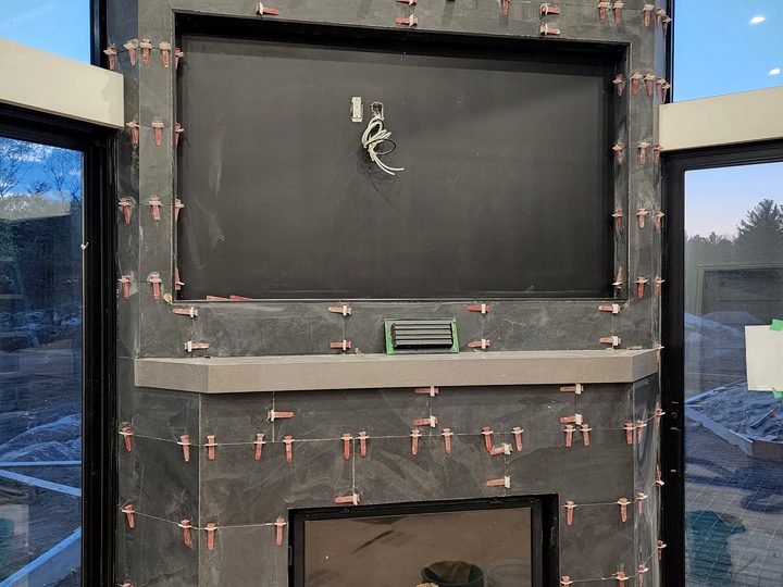 Fireplace installation during interior construction