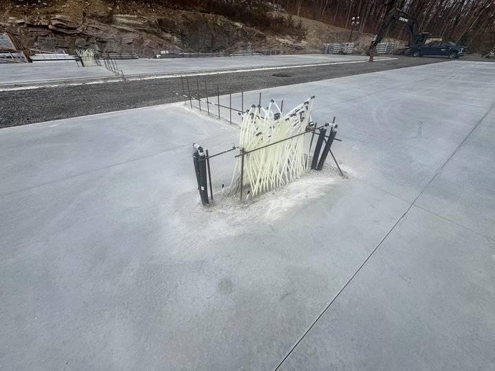 Service rough-ins emerging through a finished slab