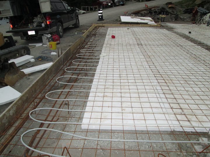 Radiant heating tubing laid out across an interior floor
