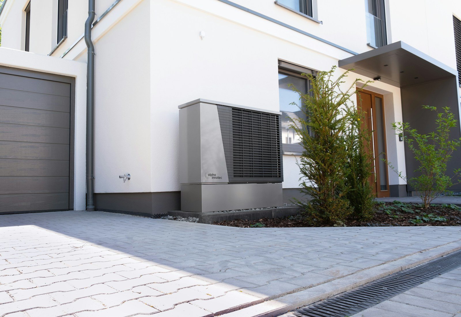 Modern house exterior with an outdoor heat pump unit
